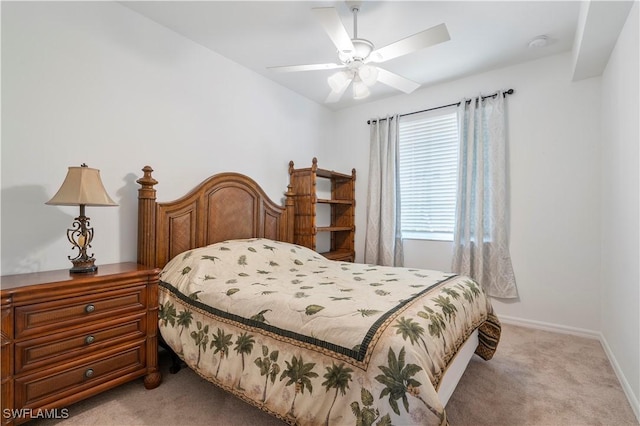 bedroom with light carpet and ceiling fan