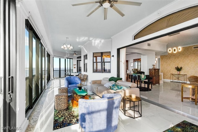 living room featuring ceiling fan with notable chandelier