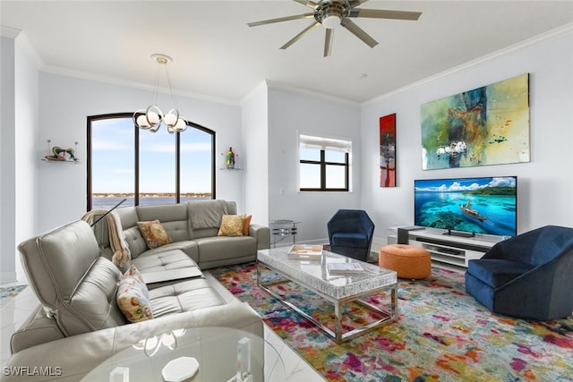 living room with ceiling fan with notable chandelier and ornamental molding