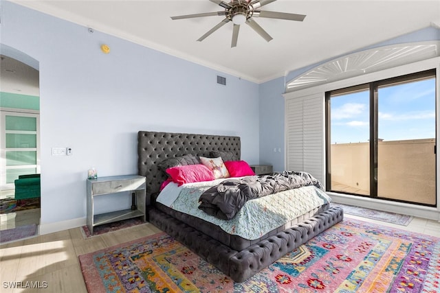 bedroom featuring ceiling fan, hardwood / wood-style flooring, and crown molding