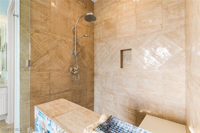 bathroom with a tile shower