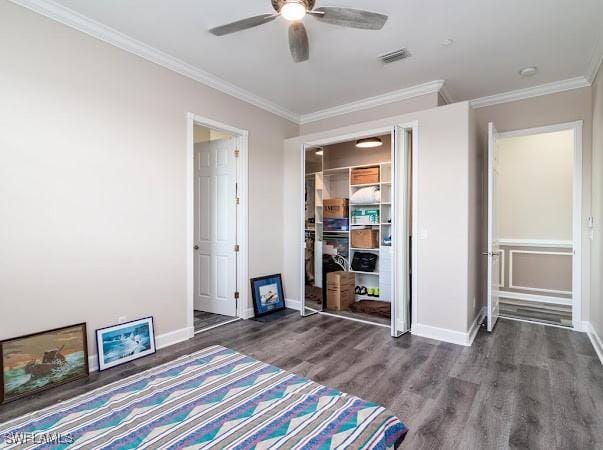 unfurnished bedroom featuring ceiling fan, dark hardwood / wood-style floors, and ornamental molding