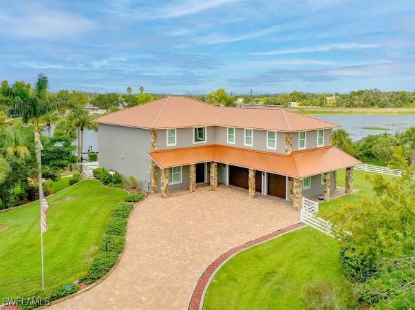 view of front of house with a water view