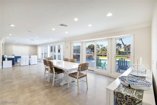 dining room featuring light tile patterned floors, recessed lighting, visible vents, and ornamental molding