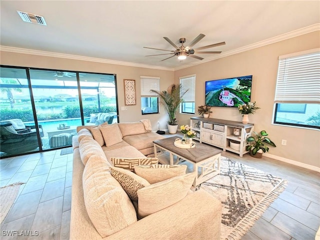 living room with ceiling fan and ornamental molding