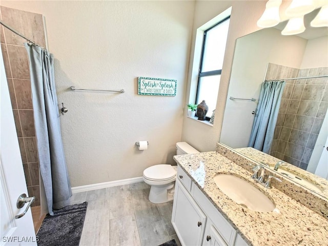 bathroom with hardwood / wood-style flooring, vanity, toilet, and a shower with curtain