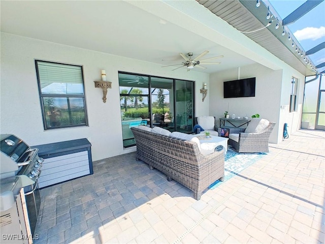 view of patio / terrace with an outdoor hangout area, ceiling fan, and a lanai