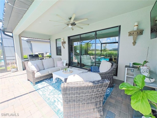 view of patio / terrace featuring an outdoor living space, ceiling fan, and a lanai