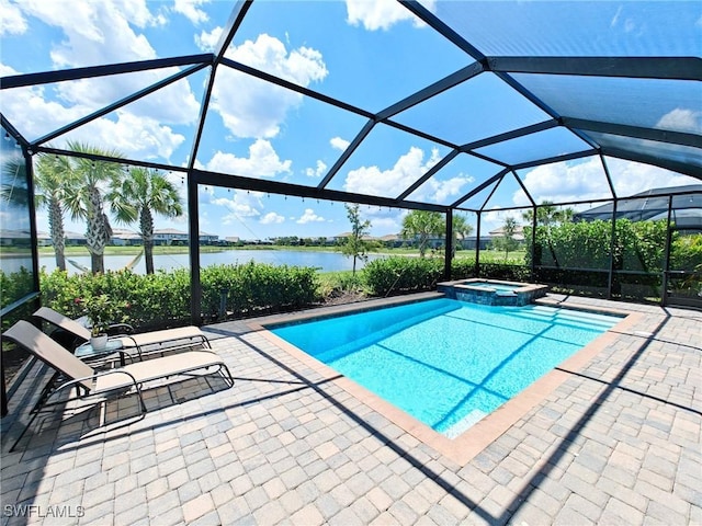 view of swimming pool with a lanai, a patio area, an in ground hot tub, and a water view