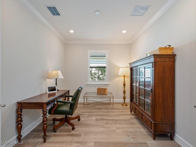 home office with light wood-type flooring and crown molding