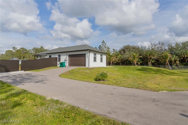 view of property exterior featuring a yard and a garage