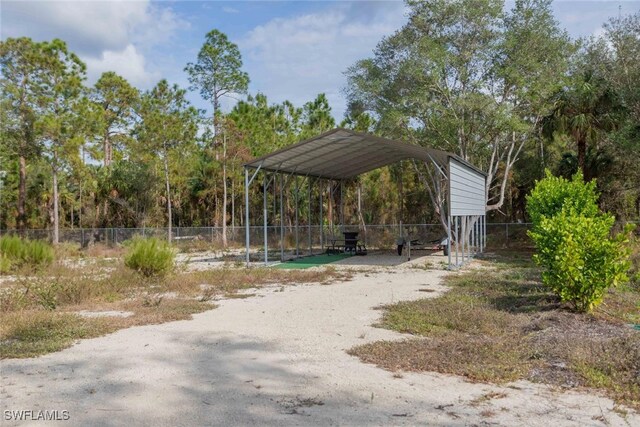 view of vehicle parking with a carport