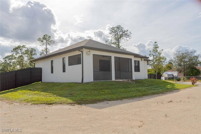 view of side of home featuring a lawn