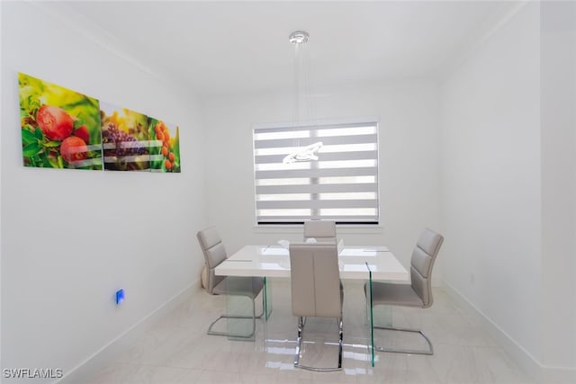 dining area featuring crown molding