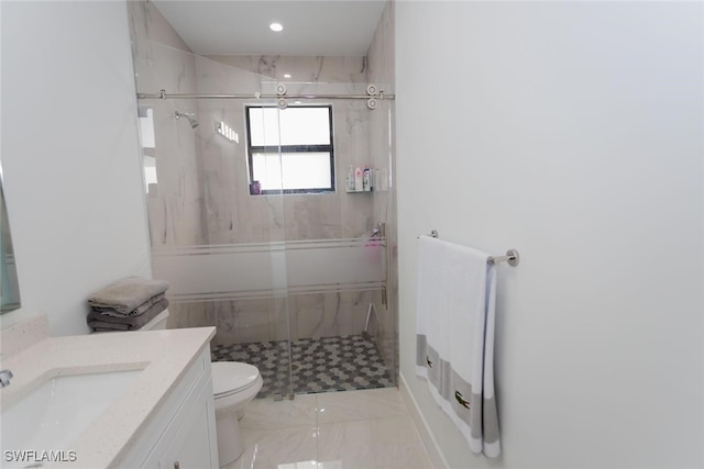 bathroom with vanity, toilet, and walk in shower