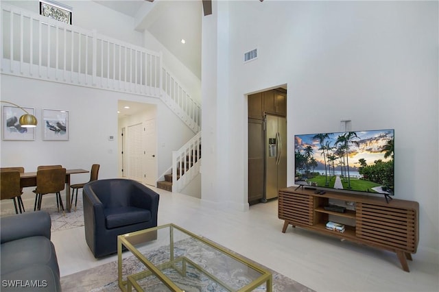 living room with a high ceiling