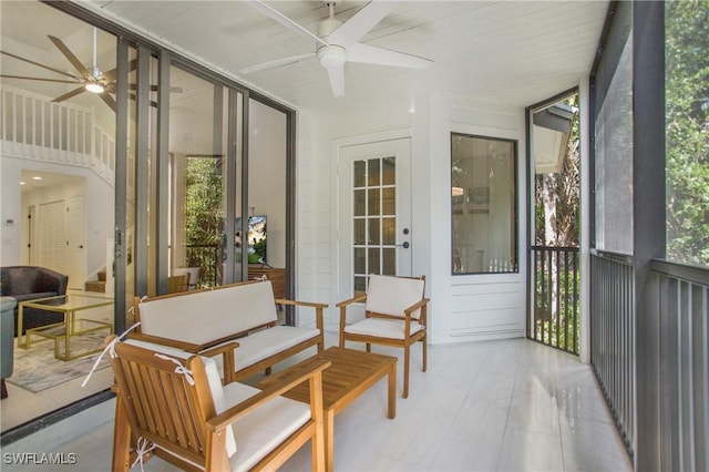 sunroom / solarium with ceiling fan