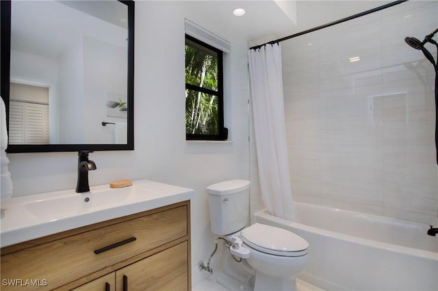 full bathroom with shower / bath combination with curtain, vanity, and toilet