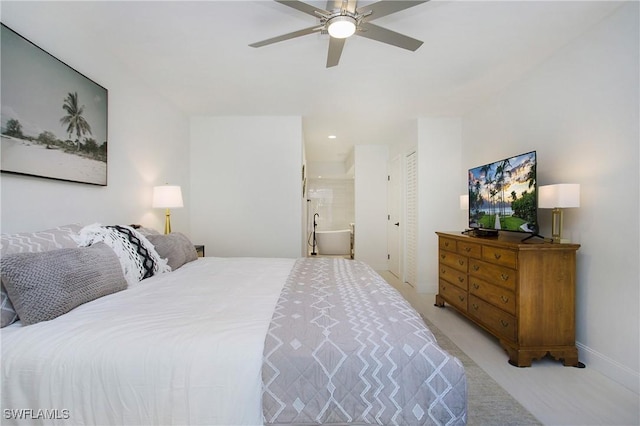 carpeted bedroom featuring connected bathroom and ceiling fan