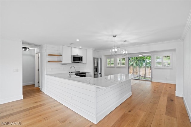 kitchen with white cabinetry, hanging light fixtures, stainless steel appliances, backsplash, and kitchen peninsula