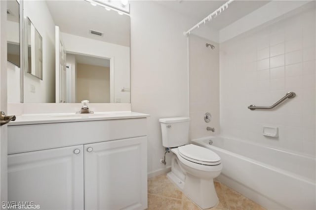 full bathroom featuring toilet, tile patterned flooring, tiled shower / bath, and vanity