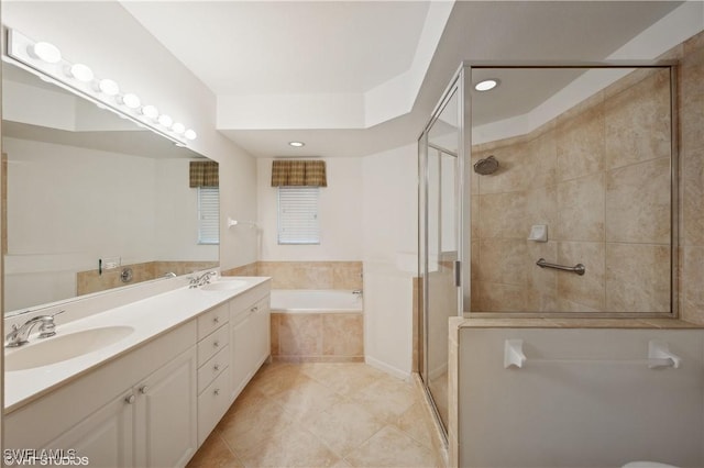 bathroom with independent shower and bath, tile patterned floors, and vanity