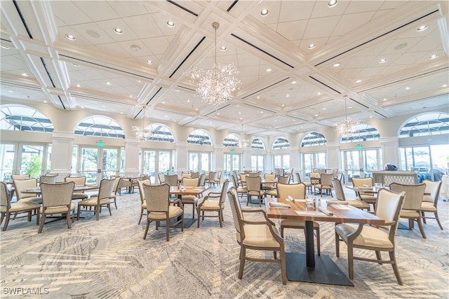 dining room featuring coffered ceiling, carpet floors, a high ceiling, a notable chandelier, and french doors