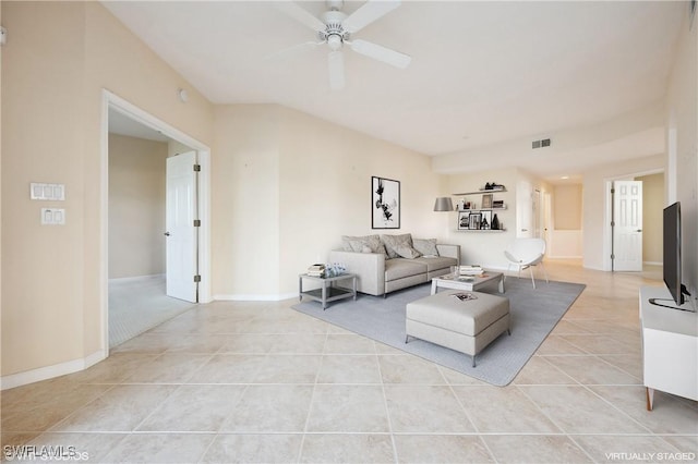 living room with ceiling fan and light tile patterned floors