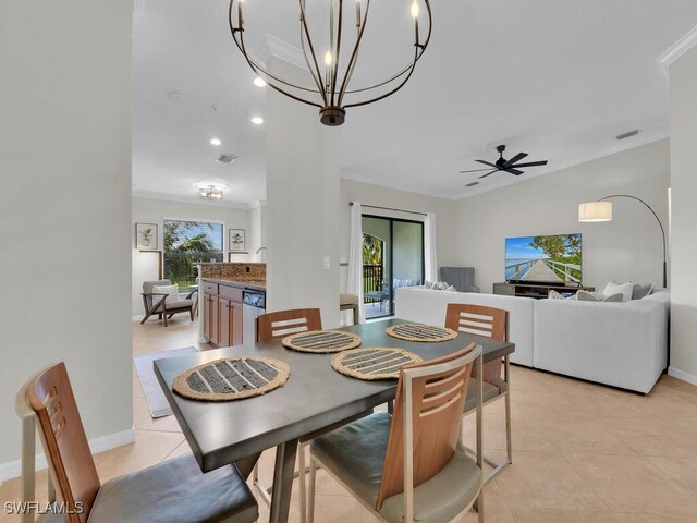 tiled dining room featuring crown molding, a healthy amount of sunlight, and ceiling fan