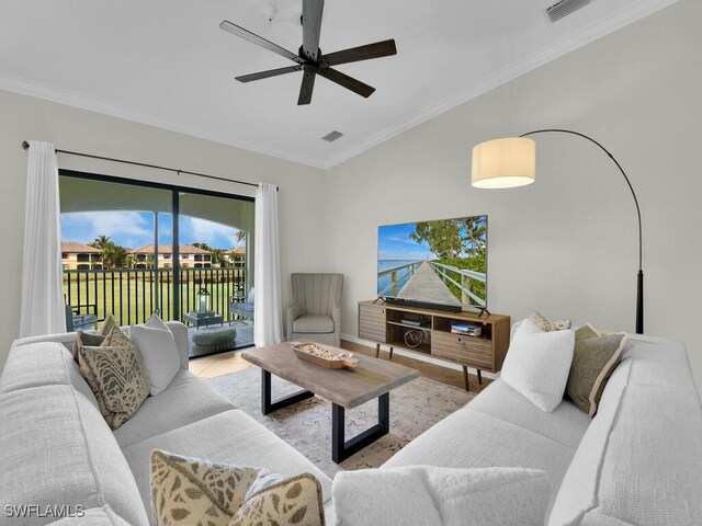 living room featuring crown molding and ceiling fan