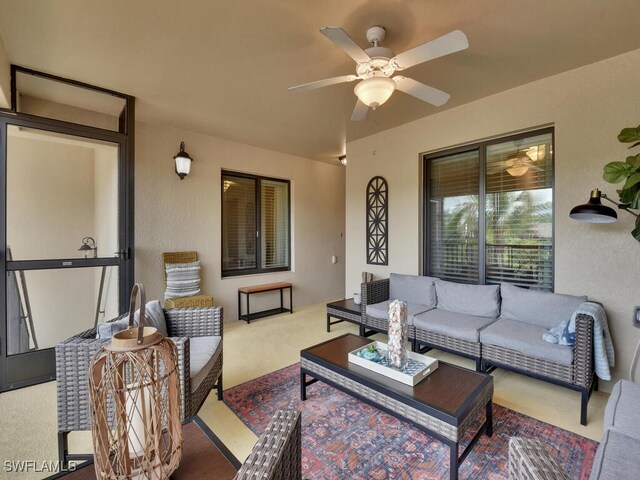 view of patio with ceiling fan and an outdoor hangout area