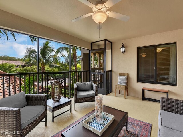 sunroom with plenty of natural light and ceiling fan