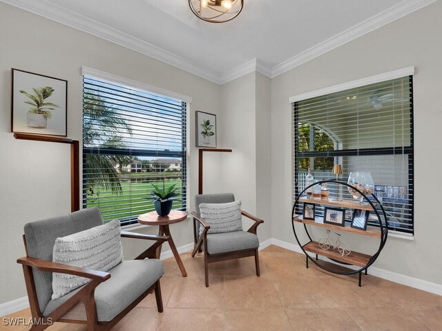 living area with light tile patterned floors and ornamental molding