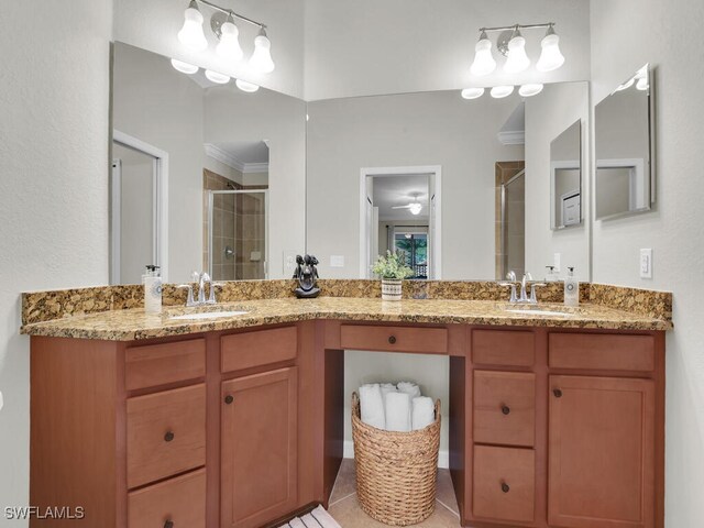 bathroom featuring walk in shower, ornamental molding, and vanity