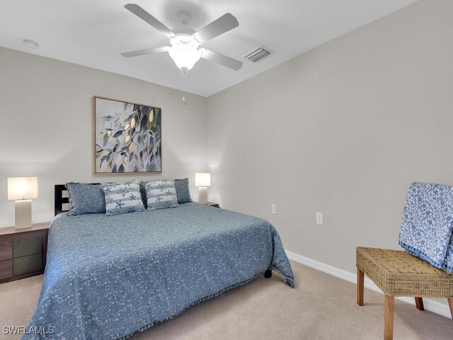 carpeted bedroom with ceiling fan