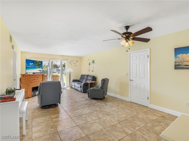 tiled living room with ceiling fan