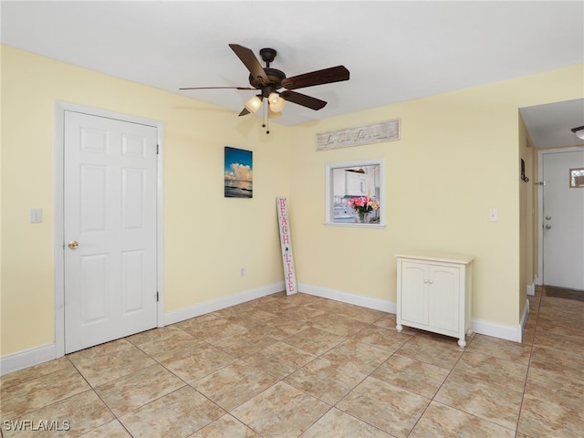 unfurnished room with ceiling fan