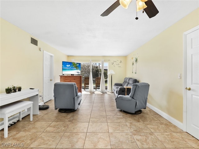 living room featuring ceiling fan and light tile patterned floors