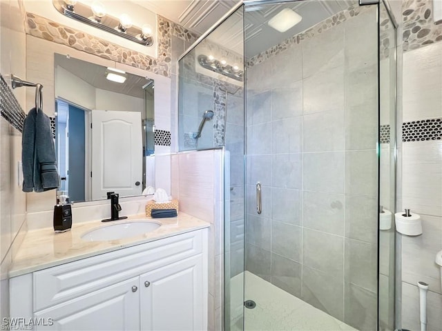 bathroom with vanity and an enclosed shower