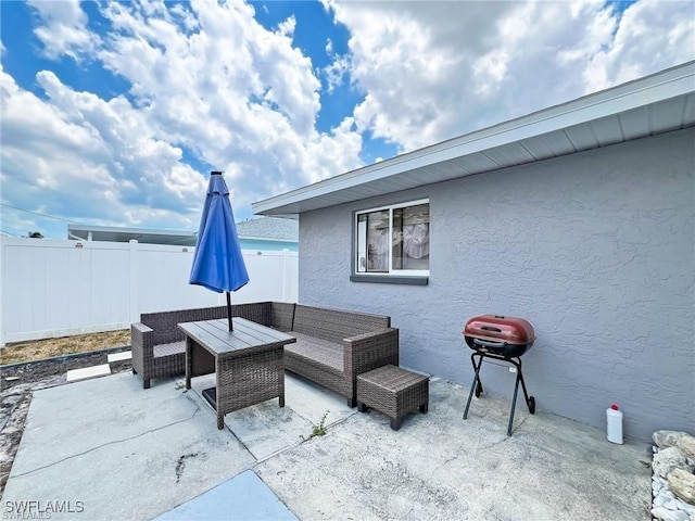 view of patio / terrace featuring an outdoor living space and grilling area