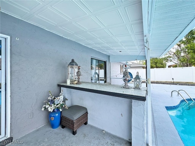 view of patio / terrace featuring a fenced in pool