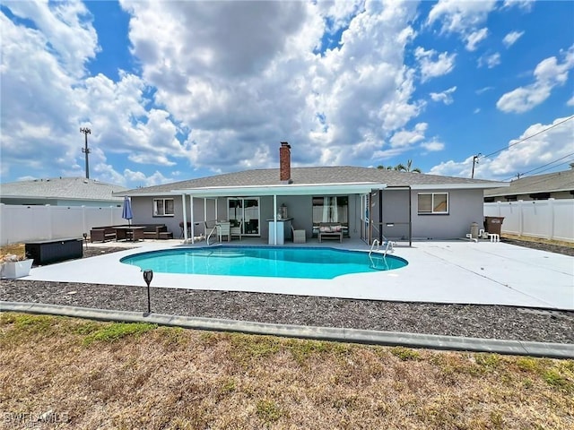 view of pool featuring outdoor lounge area and a patio area