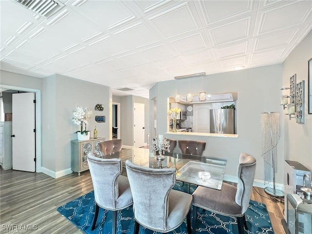 dining area featuring hardwood / wood-style floors