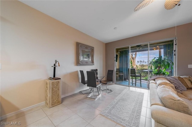 interior space featuring light tile patterned floors and ceiling fan