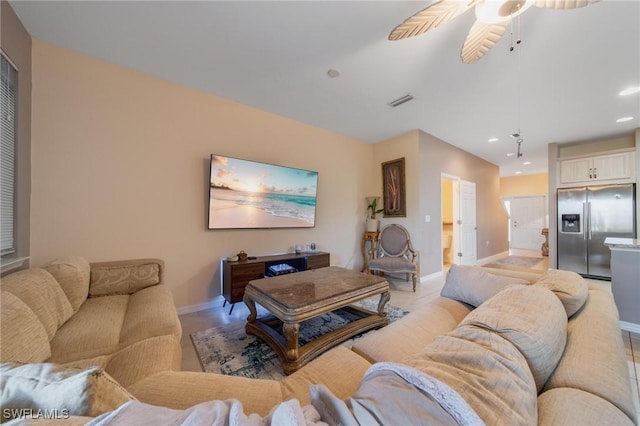 tiled living room featuring ceiling fan