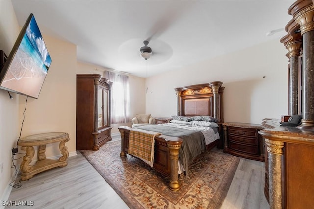 bedroom featuring ceiling fan and wood-type flooring