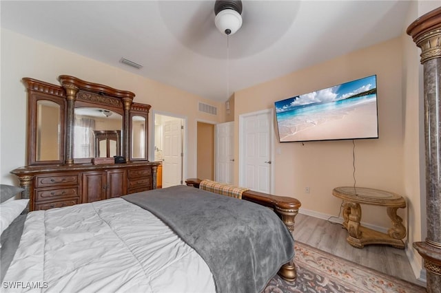 bedroom featuring hardwood / wood-style floors and ceiling fan