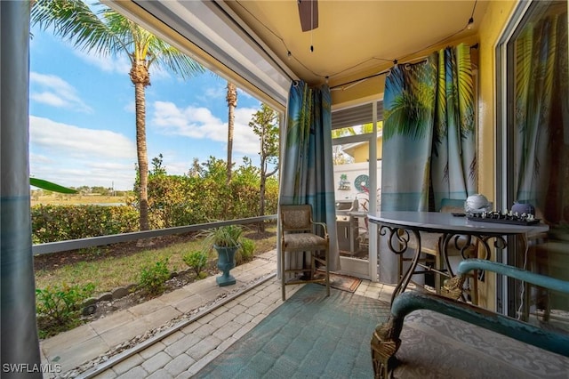 sunroom / solarium with ceiling fan