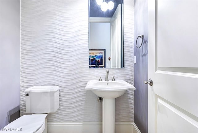 bathroom with sink and toilet