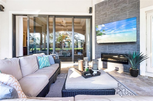 living room with a tiled fireplace